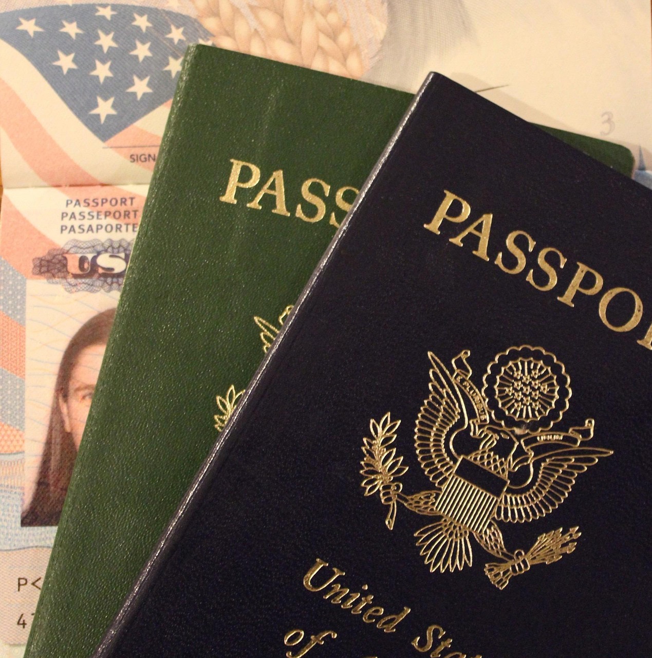 Saudi Arabia tourist visa and passport and travel documents on a wooden table