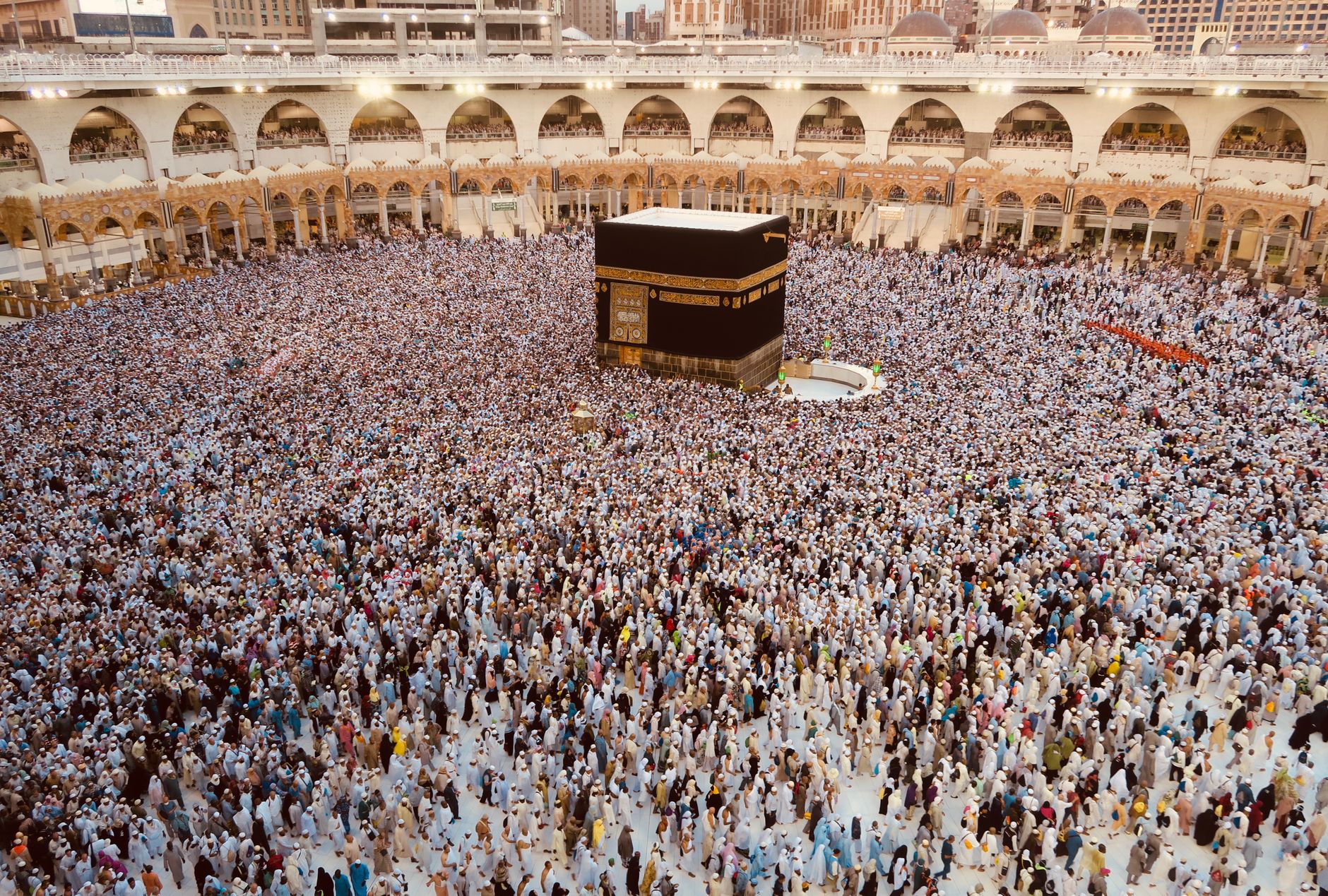 Muslim pilgrim preparing for Umrah ihram in Makkah, simple respectful travel photo