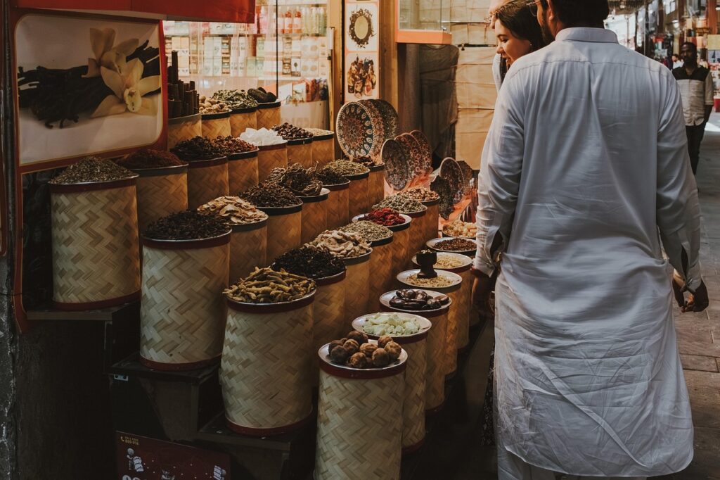 Madinah date market Souq al-Tamr with piles of dates and shoppers