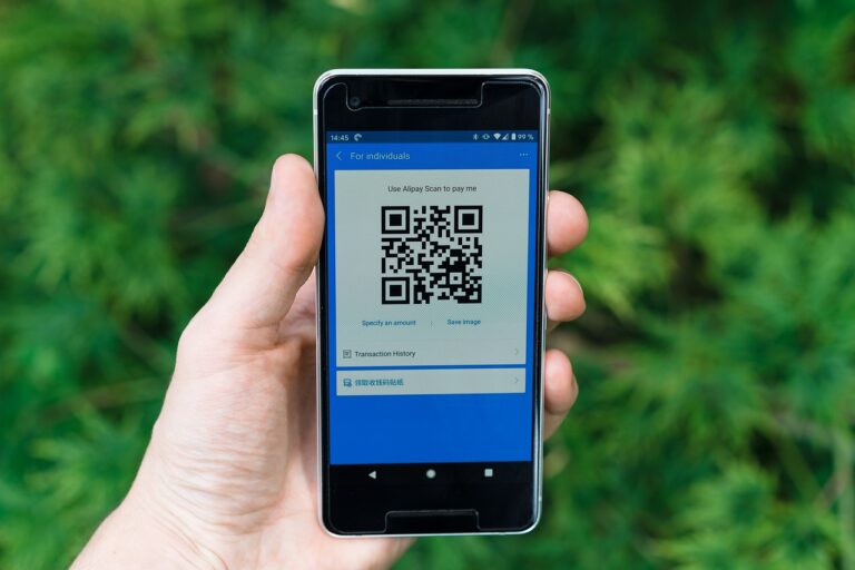 Nusuk app on phone screen with Umrah permit QR code