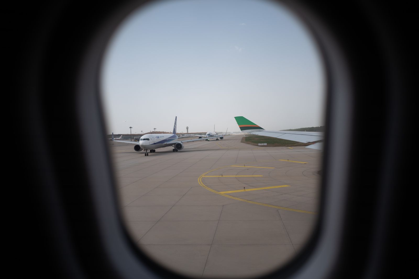 Passenger aircraft viewed through an airport window