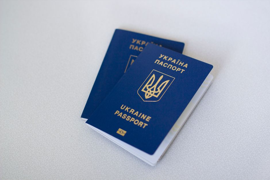 Blue passports on a light surface, highlighting travel documents