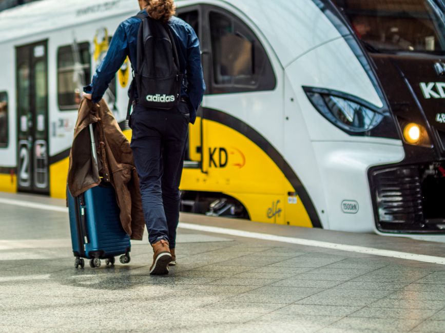 Passenger preparing luggage for a train journey